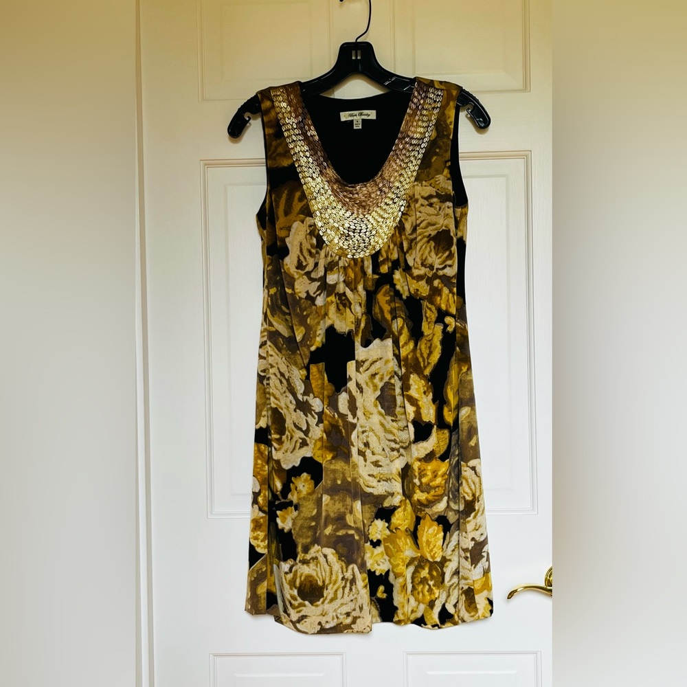 Gold & Black silk sleeveless dress w gold & bronze metal design on neckline.